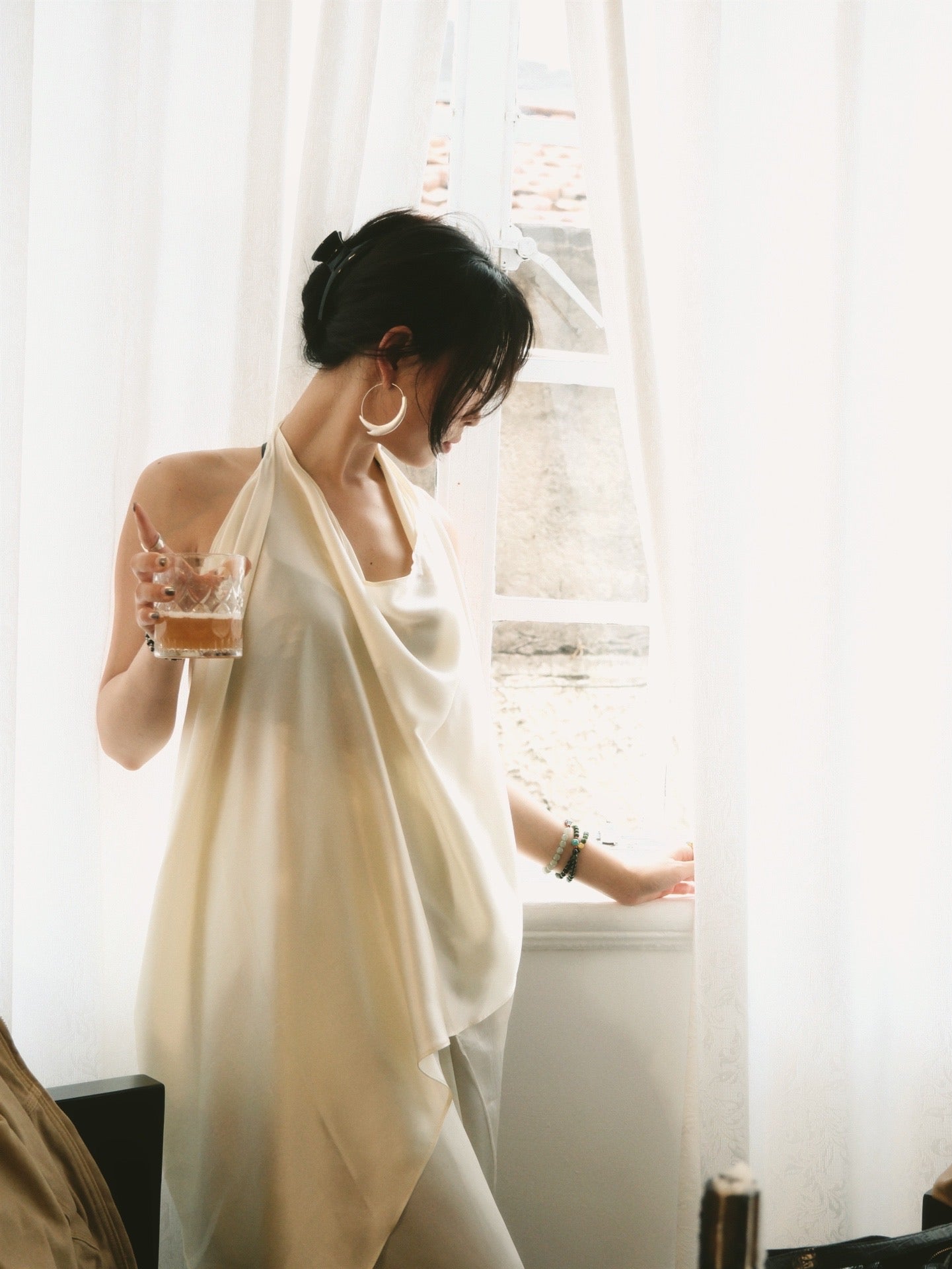 Sculptural draped halter top
