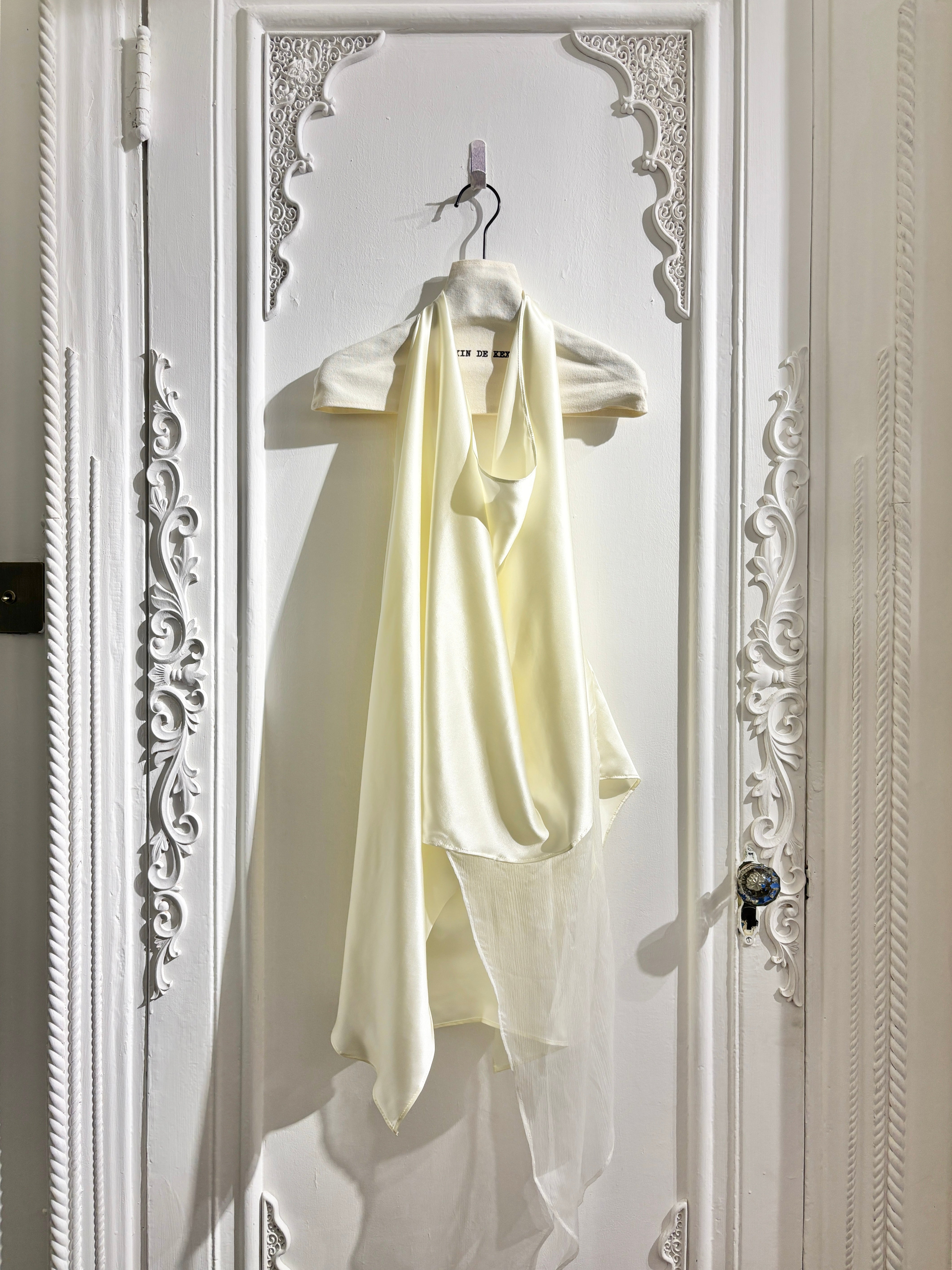 Sculptural draped halter top