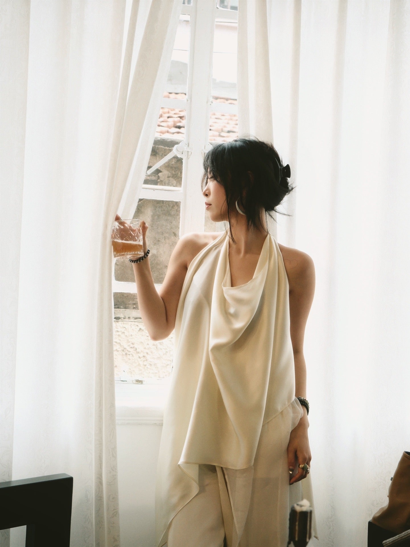 Sculptural draped halter top